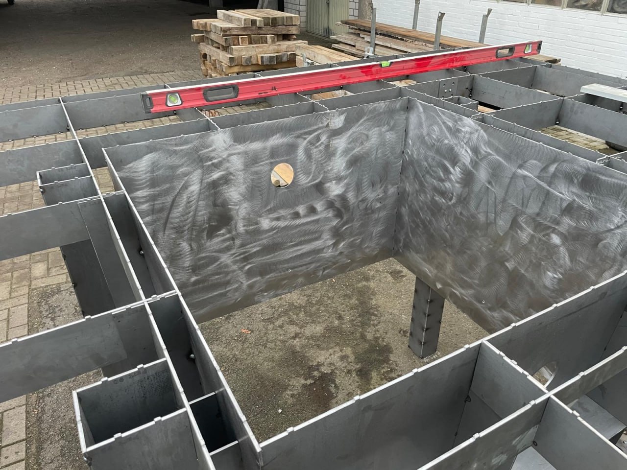 Open steel mold components showing internal structure and support surfaces